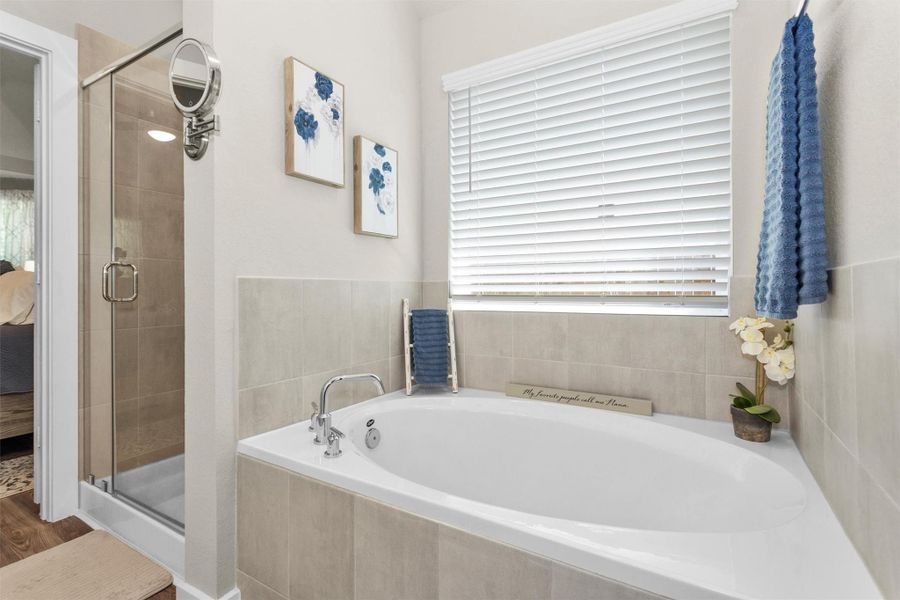 And a view of your soaking tub and stand up, seamless glass door shower. And a view of your soaking tub and stand up, seamless glass door shower.