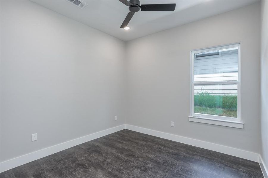 Unfurnished room with dark wood finished floors, recessed lighting, and ceiling fan Unfurnished room with dark wood finished floors, recessed lighting, and ceiling fan