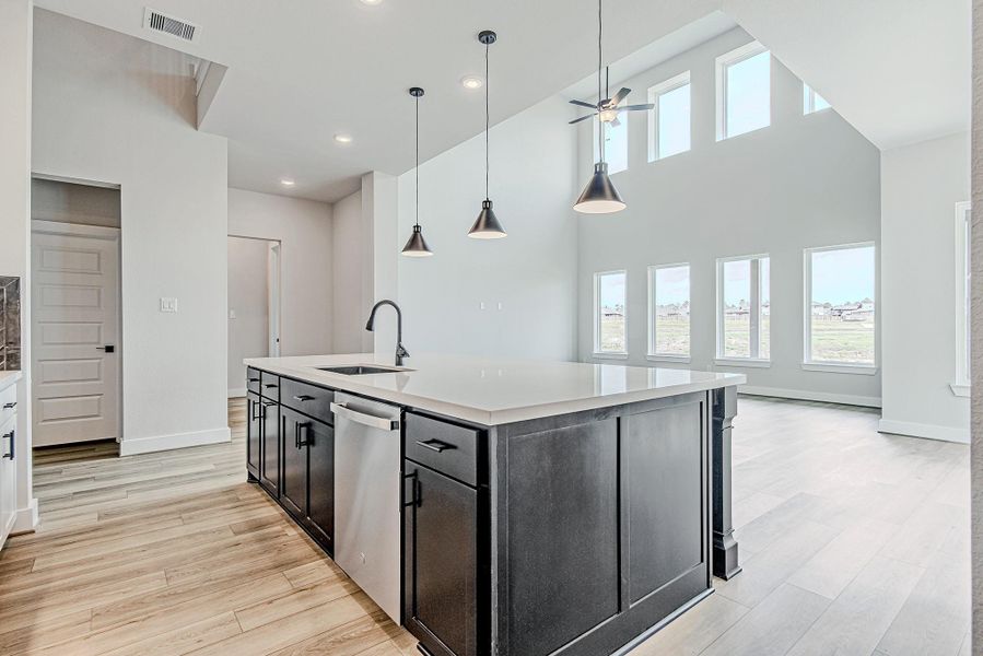 Kitchen with oversized island and breakfast bar, ideal for casual dining and gatherings.