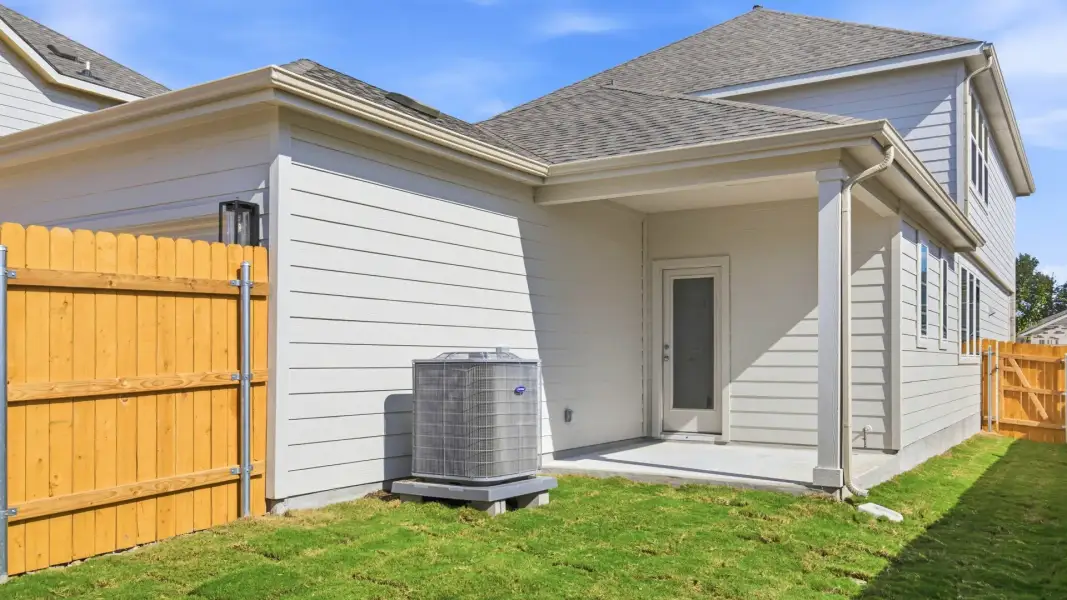 Exterior details and patio area of a home in Creeks Crossing, Elgin (Image 22).