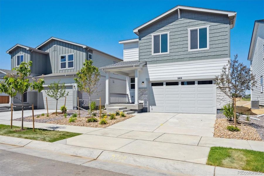 Front exterior of a new home in Farmlore, Brighton, CO, highlighting curb appeal (Image 15). Front exterior of a new home in Farmlore, Brighton, CO, highlighting curb appeal (Image 15).