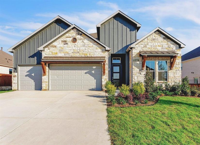 Front exterior of a new home in Oaks Preserve, Mansfield, TX, highlighting curb appeal (Image 16).