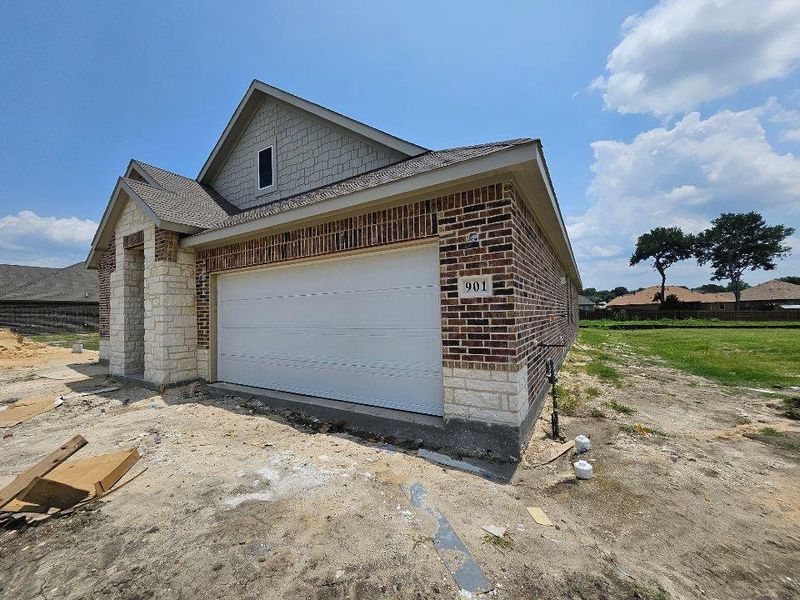 In-progress construction of a new home in The Hollow, Ennis, TX (Image 6).