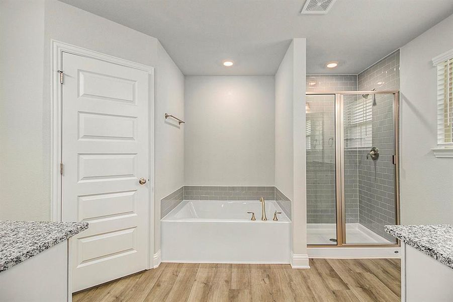 Primary Bathroom with Separate Shower and Bathtub