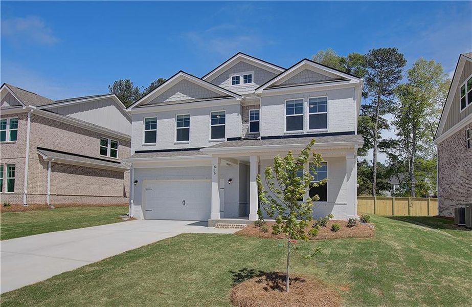 Front exterior of a new home in Bowers Farm, McDonough, GA, highlighting curb appeal (Image 16). Front exterior of a new home in Bowers Farm, McDonough, GA, highlighting curb appeal (Image 16).