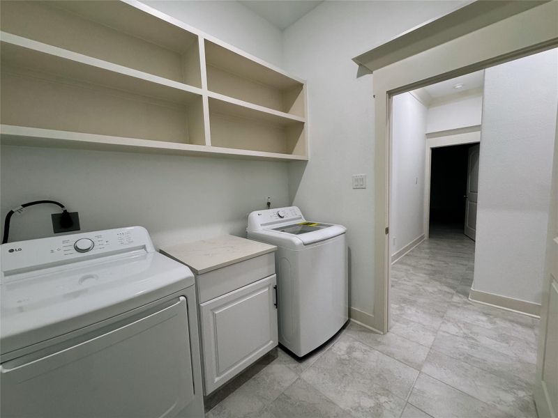 Washer/Dryer included in appliance package. Plenty storage above and counter/cabinet below