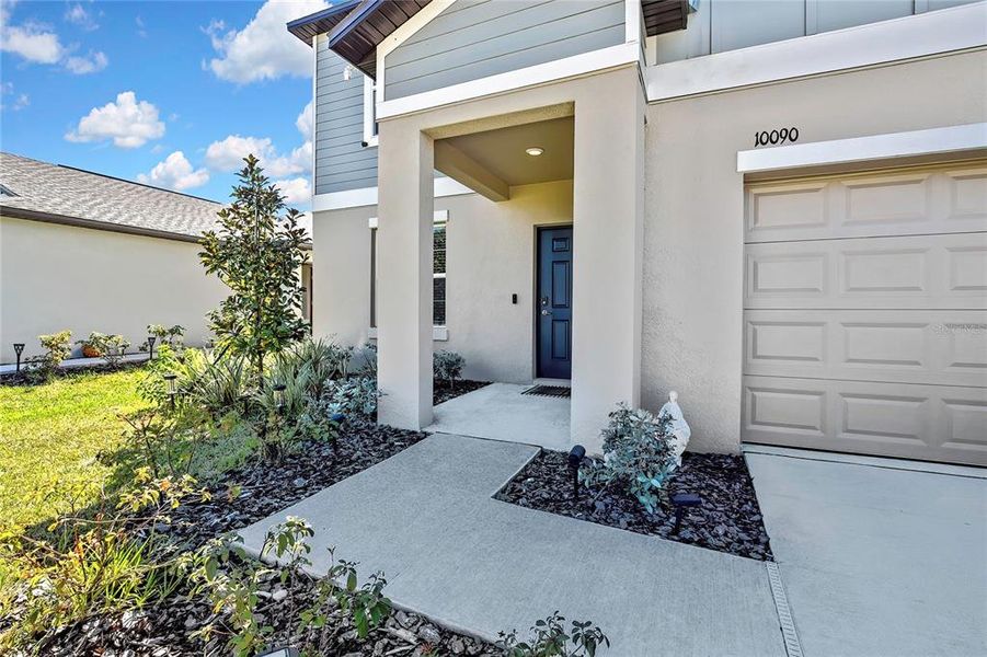 Exterior details and patio area of a home in Angeline: The Estates, Land O' Lakes (Image 25).