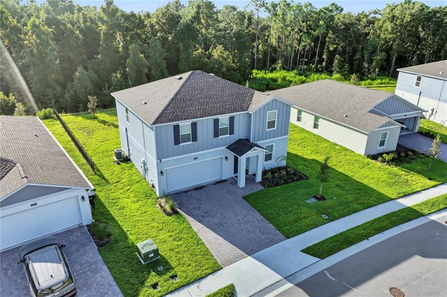 Front exterior of a new home in Providence, Davenport, FL, highlighting curb appeal (Image 20). Front exterior of a new home in Providence, Davenport, FL, highlighting curb appeal (Image 20).