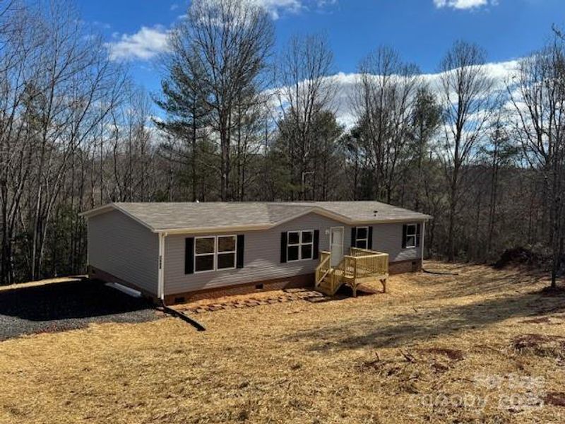 Front exterior of a new home in , Lenoir, NC, highlighting curb appeal (Image 1).