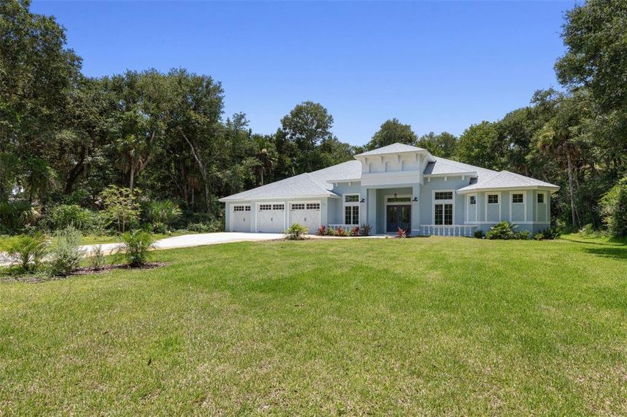 Front exterior of a new home in , Flagler Beach, FL, highlighting curb appeal (Image 2). Front exterior of a new home in , Flagler Beach, FL, highlighting curb appeal (Image 2).
