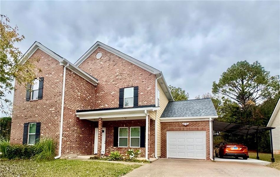 Front exterior of a new home in , Rex, GA, highlighting curb appeal (Image 1). Front exterior of a new home in , Rex, GA, highlighting curb appeal (Image 1).