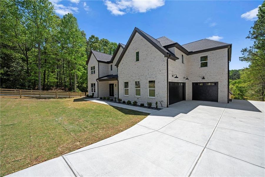 Front exterior of a new home in , Lawrenceville, GA, highlighting curb appeal (Image 26).