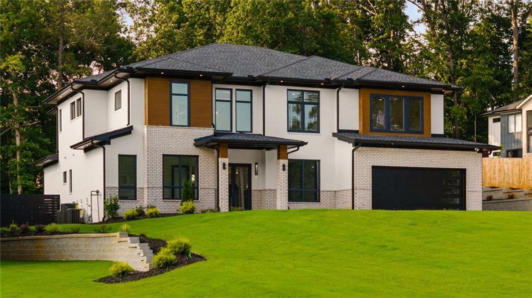 Front exterior of a new home in , Sugar Hill, GA, highlighting curb appeal (Image 37). Front exterior of a new home in , Sugar Hill, GA, highlighting curb appeal (Image 37).