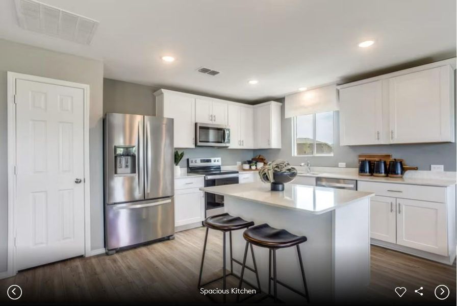 Interior photos- Photo of Pulte model home with same floor plan, not of actual home listed.