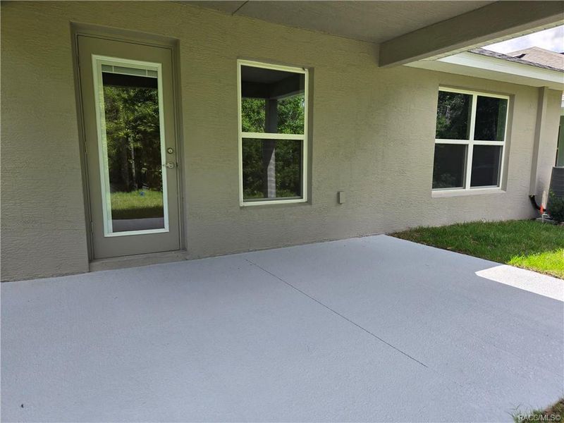 Exterior details and patio area of a home in Wyld Palms, Inverness (Image 2).