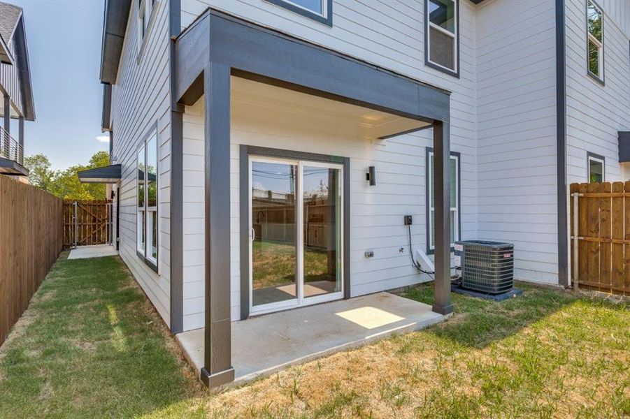 Rear view of property featuring a patio area Rear view of property featuring a patio area