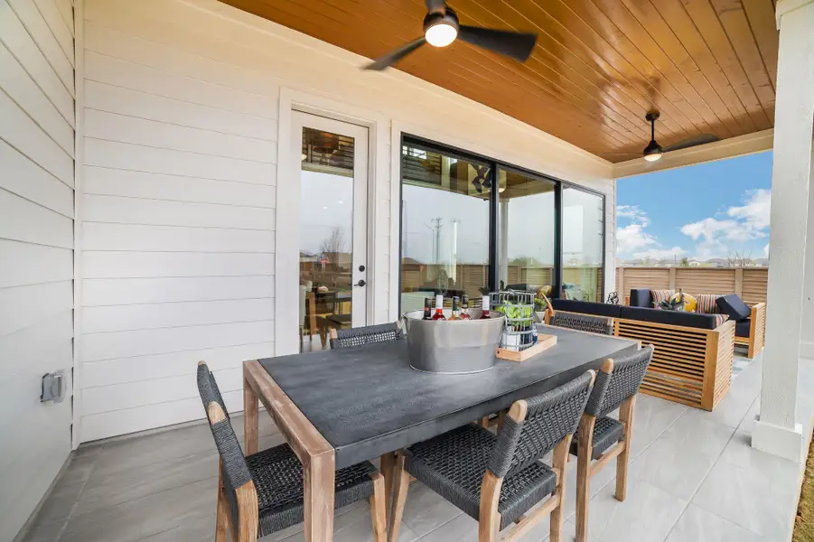 View of patio with a ceiling fan and outdoor lounge area