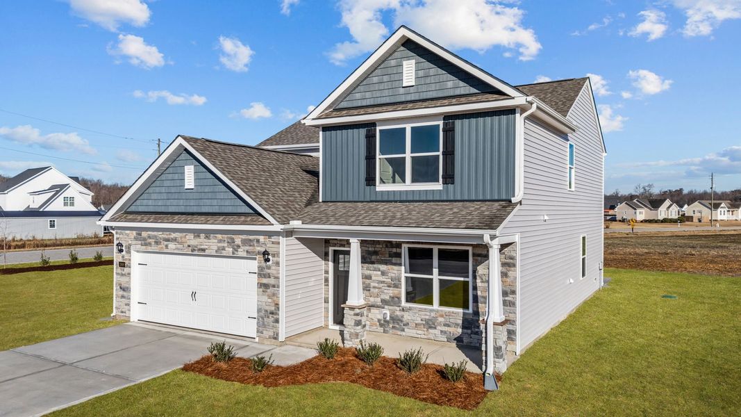 Front exterior of a new home in Dail Farm, Farmville, NC, highlighting curb appeal (Image 21). Front exterior of a new home in Dail Farm, Farmville, NC, highlighting curb appeal (Image 21).