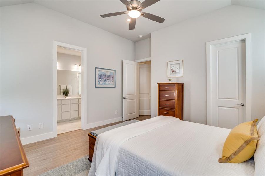 This master bedroom view shows the bath entrance in the background and the closet entrance on the right.