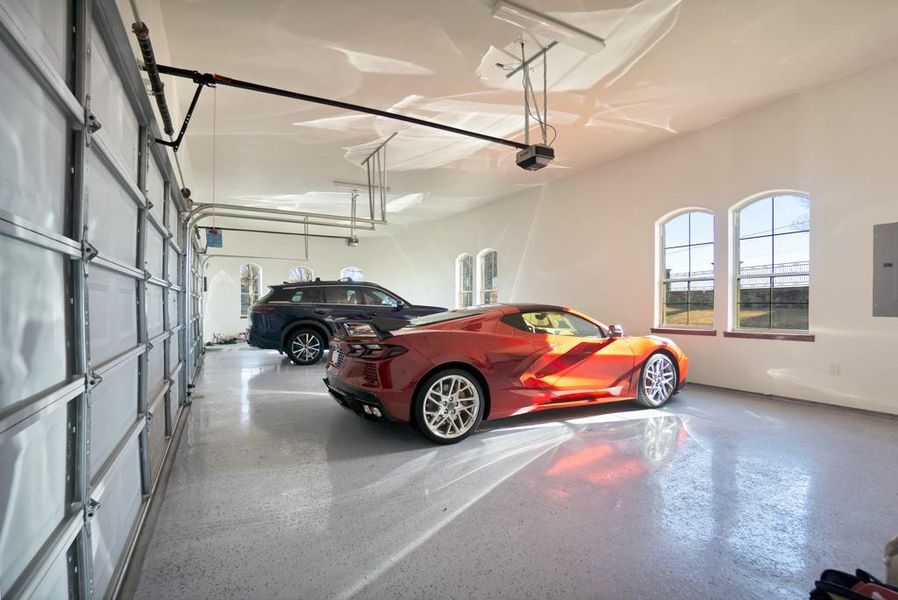 Garage with a garage door opener and electric panel