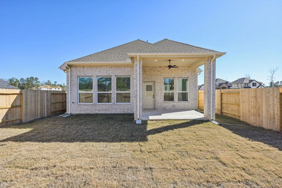 Exterior details and patio area of a home in Evergreen, Conroe (Image 4).