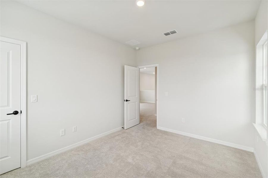 Spacious, unfurnished interior of a new home in Laureate Park at Lake Nona - Garden Series, Orlando (Image 37).