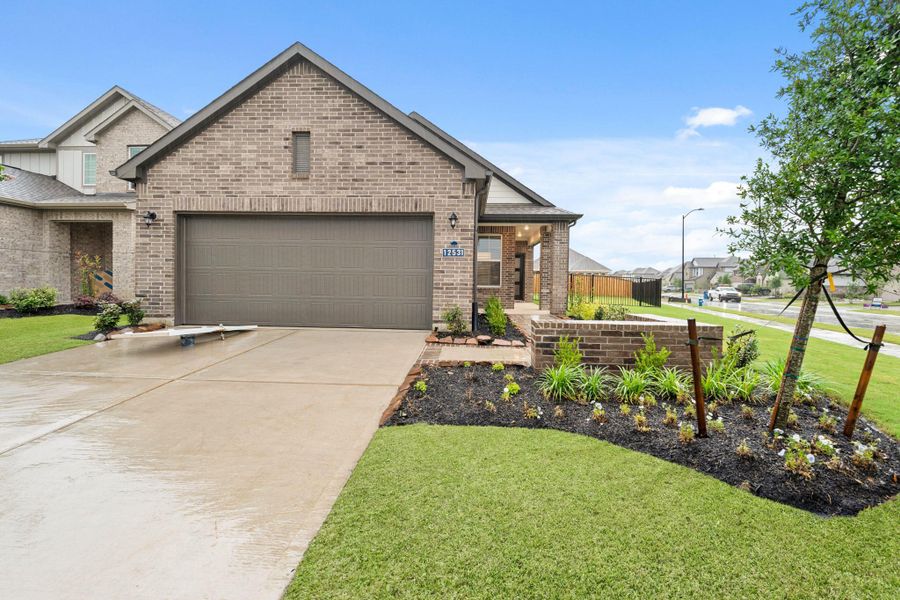 Front exterior of a new home in Creekland Village at Bridgeland, Cypress, TX, highlighting curb appeal (Image 2). Front exterior of a new home in Creekland Village at Bridgeland, Cypress, TX, highlighting curb appeal (Image 2).