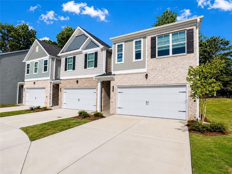 Front exterior of a new home in Lake Harbin, Morrow, GA, highlighting curb appeal (Image 19). Front exterior of a new home in Lake Harbin, Morrow, GA, highlighting curb appeal (Image 19).
