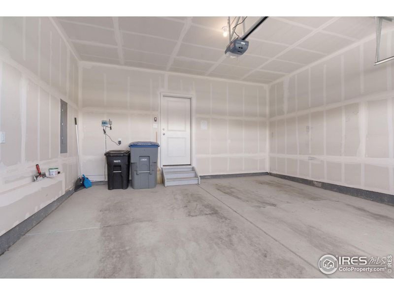 High Ceilings in Oversized Garage Allows for Additional Hanging Storage Space