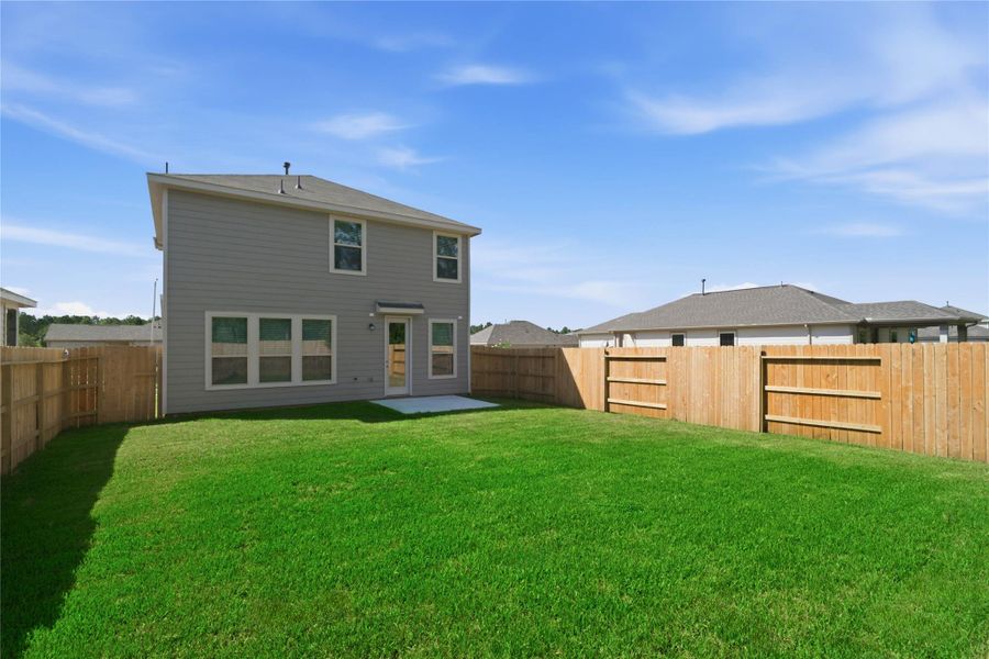 Fully fenced backyard featuring a spacious patio and a pristine blank canvas ready for your custom outdoor vision. Fully fenced backyard featuring a spacious patio and a pristine blank canvas ready for your custom outdoor vision.