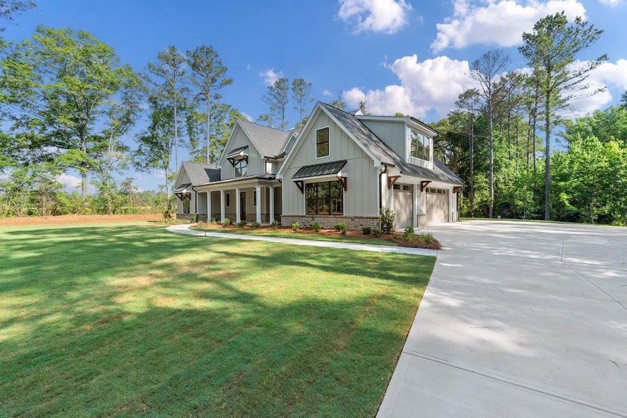 Front exterior of a new home in , Carrollton, GA, highlighting curb appeal (Image 27).