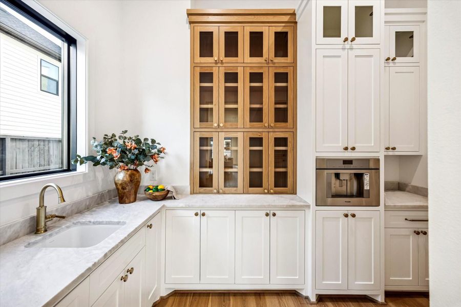 Secondary prep area extends the kitchen’s functionality with additional sink, built-in coffee maker, counter space, and enclosed storage for small appliances and serving pieces. Positioned just off the main kitchen, it keeps daily tasks and hosting organized and out of sight.**Previous build by Arch Angelo** Secondary prep area extends the kitchen’s functionality with additional sink, built-in coffee maker, counter space, and enclosed storage for small appliances and serving pieces. Positioned just off the main kitchen, it keeps daily tasks and hosting organized and out of sight.**Previous build by Arch Angelo**