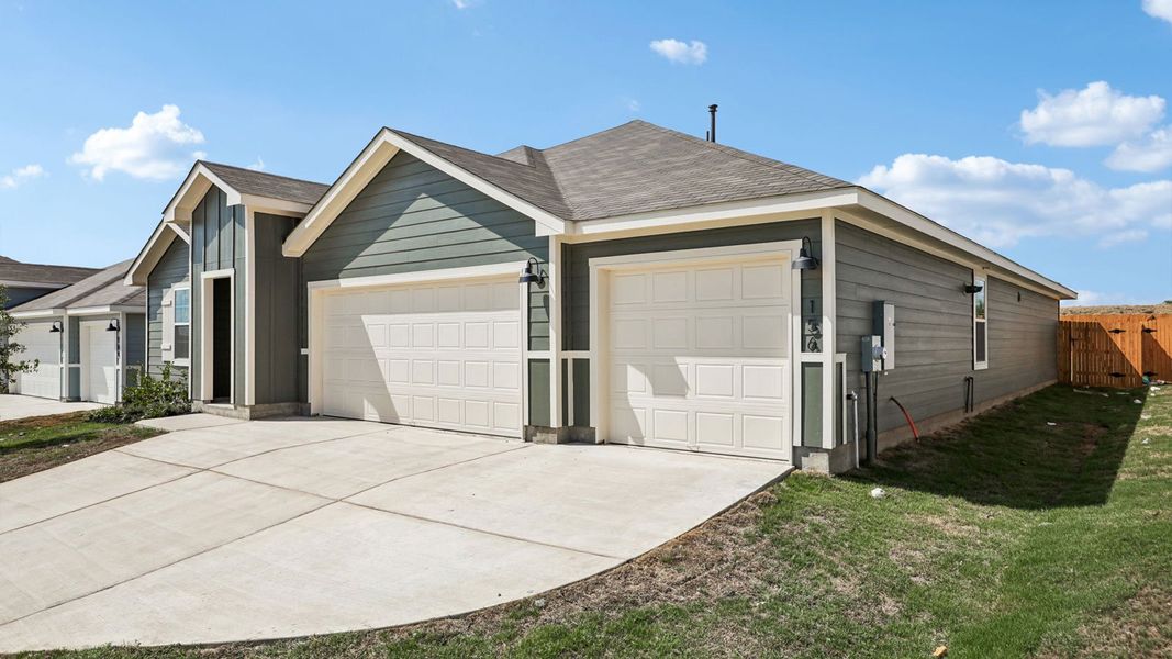 Front exterior of a new home in Prairie Lakes, Buda, TX, highlighting curb appeal (Image 20).