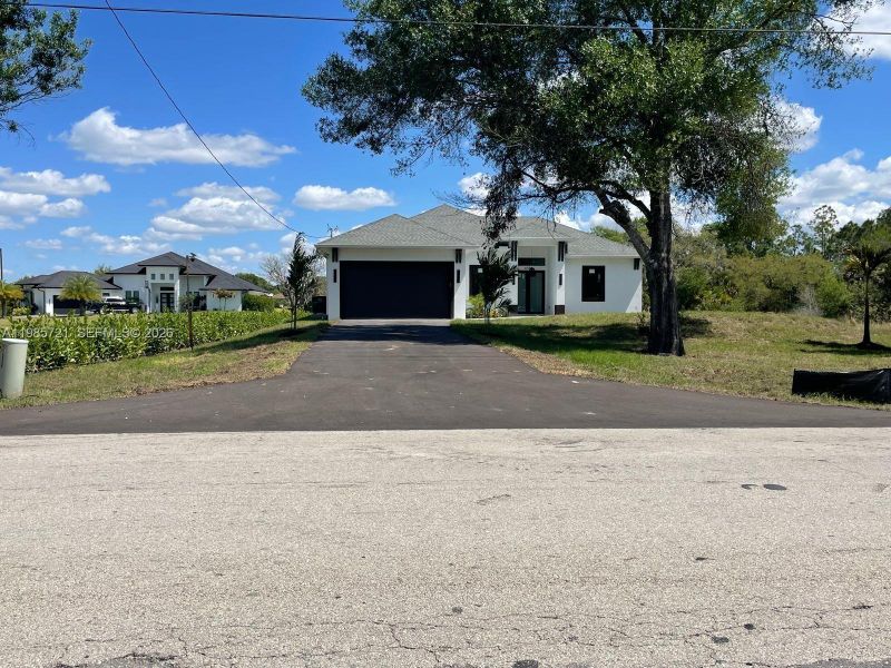 Front exterior of a new home in , Naples, FL, highlighting curb appeal (Image 19). Front exterior of a new home in , Naples, FL, highlighting curb appeal (Image 19).