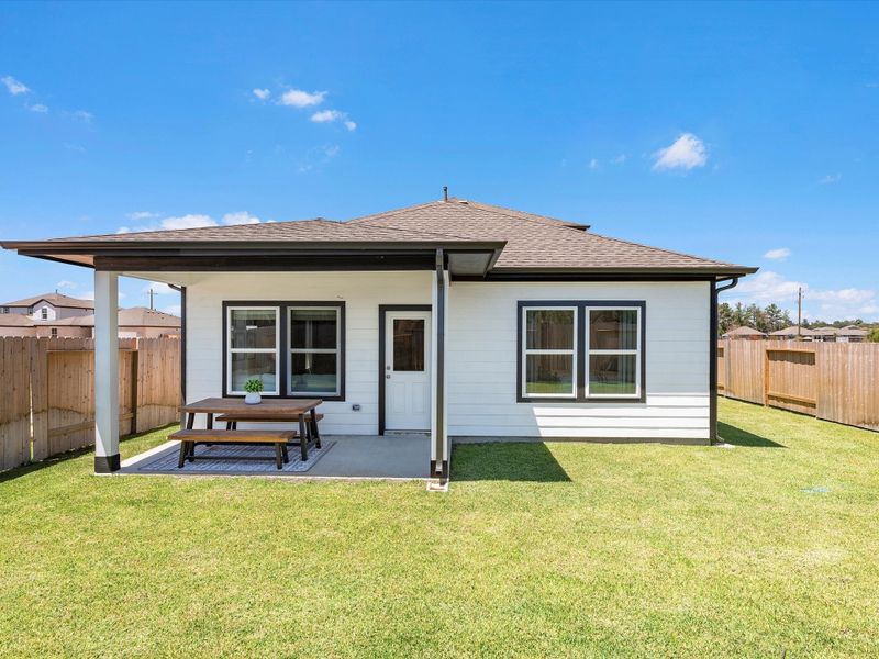 A small house with a picnic table. A small house with a picnic table.