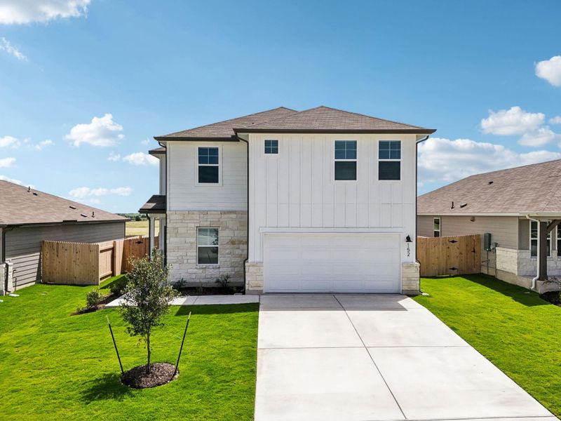 View of front of home featuring stone siding, driveway, an attached garage, a shingled roof, and board and batten siding View of front of home featuring stone siding, driveway, an attached garage, a shingled roof, and board and batten siding