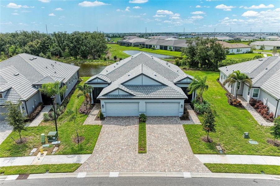 Front exterior of a new home in , Lakewood Ranch, FL, highlighting curb appeal (Image 21).
