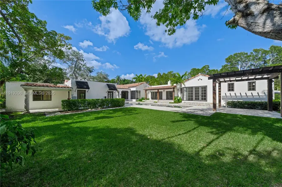 Front exterior of a new home in , Coral Gables, FL, highlighting curb appeal (Image 1). Front exterior of a new home in , Coral Gables, FL, highlighting curb appeal (Image 1).