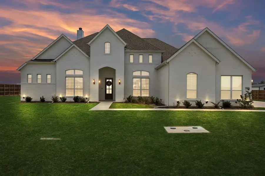 Front exterior of a new home in Springside Estates, Waxahachie, TX, highlighting curb appeal (Image 1). Front exterior of a new home in Springside Estates, Waxahachie, TX, highlighting curb appeal (Image 1).