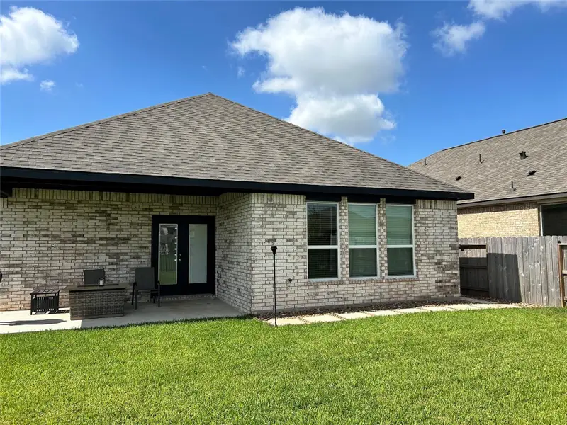 Spacious Covered Patio — Spacious back patio offering plenty of room for outdoor dining, seating, and entertaining.