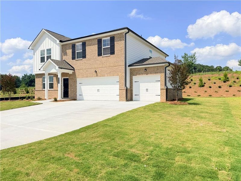 Front exterior of a new home in Apalachee Hills, Bethlehem, GA, highlighting curb appeal (Image 2). Front exterior of a new home in Apalachee Hills, Bethlehem, GA, highlighting curb appeal (Image 2).