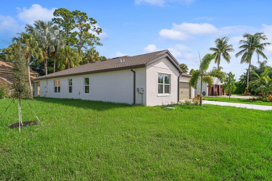 Front exterior of a new home in , Port St. Lucie, FL, highlighting curb appeal (Image 23). Front exterior of a new home in , Port St. Lucie, FL, highlighting curb appeal (Image 23).