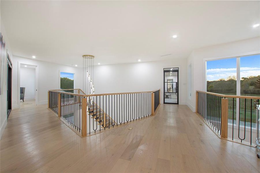 Corridor featuring light hardwood / wood-style floors