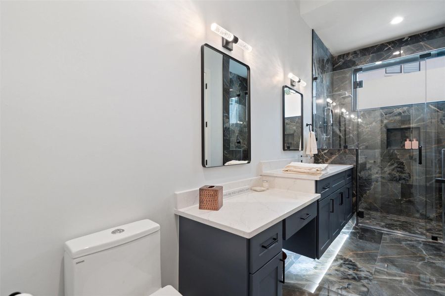 . Three additional ensuite bedrooms provide generous accommodations for family and guests alike.