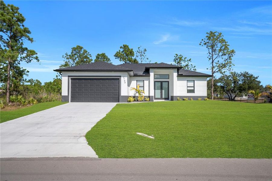 Front exterior of a new home in , Lehigh Acres, FL, highlighting curb appeal (Image 23). Front exterior of a new home in , Lehigh Acres, FL, highlighting curb appeal (Image 23).