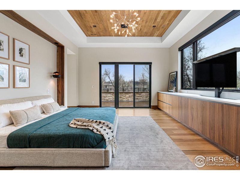 A luxury elevated walnut entertainment console with sleek Pental Quartz slab countertops.  Includes an automated lift for seamless presentation of the television