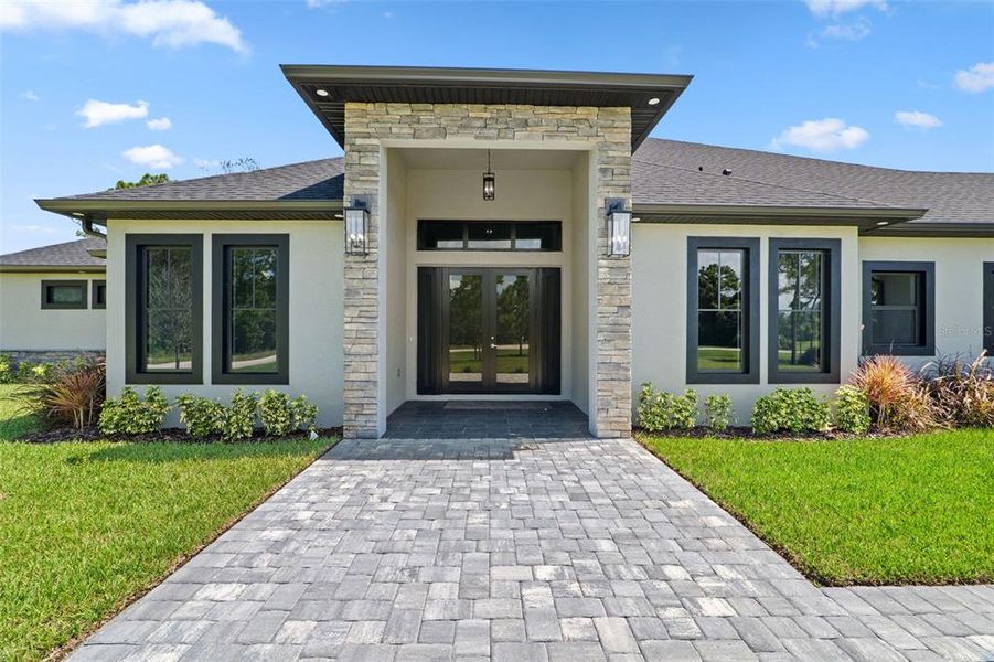 Front exterior of a new home in , Malabar, FL, highlighting curb appeal (Image 25).