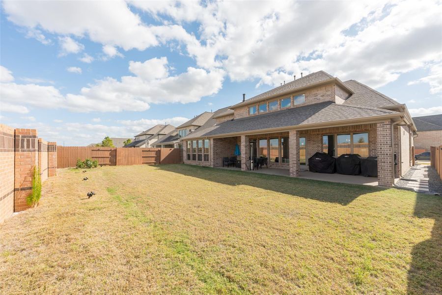 Exterior details and patio area of a home in Elyson 65', Katy (Image 4). Exterior details and patio area of a home in Elyson 65', Katy (Image 4).