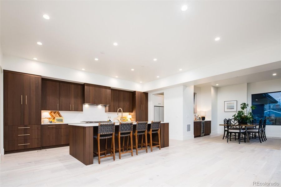 Large kitchen with a separate dining area perfect for family dinners or hosting parties