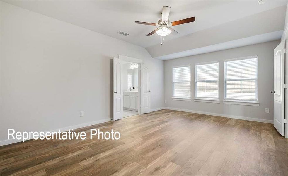 Unfurnished bedroom featuring ceiling fan and hardwood / wood-style floors